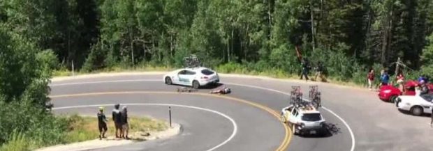 Cyclist racing downhill crashes into moving car